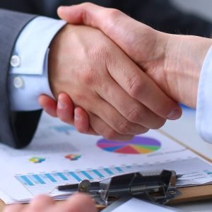 Business people shaking hands, finishing up a meeting